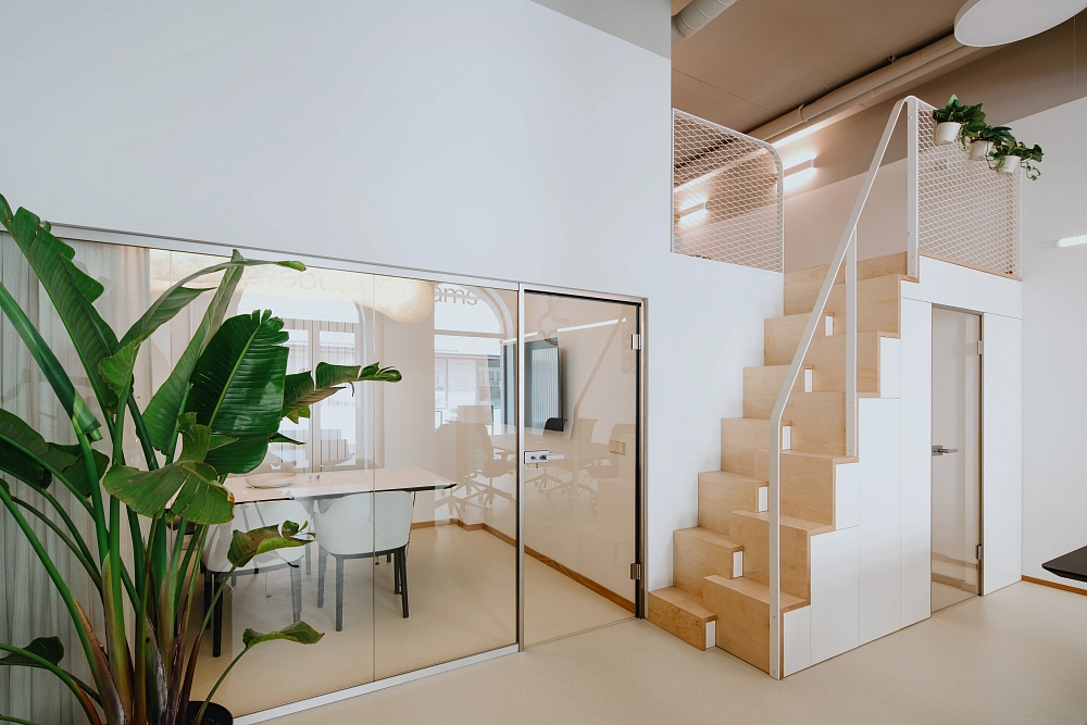 Conference room at the Ostrava branch of the Svoboda & Williams real estate agency and the staircase leading to the lounge
